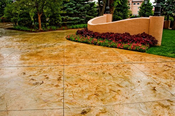 Light brown stained and stamped concrete driveway